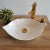 1} Elevate your bathroom with our exquisite Leaf Oval Bathroom Sink, a true work of art handcrafted by our skilled...