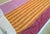 Genuine Designers Guild "Kesari" printed cotton — a gorgeous sunset ombré stripe in burgundy, orange, and gold, paired...