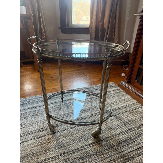 Silver plate tea cart with removeable glass tray C 1950-1960. Dimensions Ht: 22" Wd: 22" Dpth: 15" A mid 20th century...