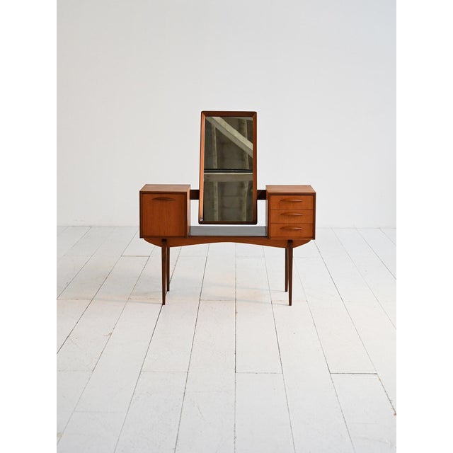 Teak veneer dressing table with adjustable mirror, door, and side drawers. "Model 315" by Svante Skogh for Slutarps,...