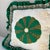 Vintage handmade quilt square ruffle pillow with stitched flowers and lace trim.