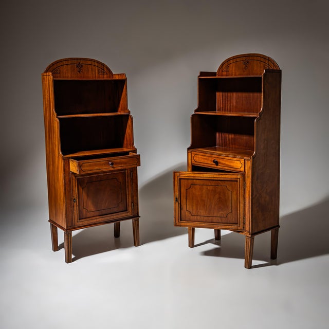 Pair of bookshelves or étagères from the 19th century. Each features two open shelves, a drawer, and a lockable lower...