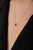 This elegant pendant necklace featuring a 0.39 carat pear-cut ruby set in 18K yellow gold. The ruby measuring...