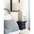 The Carmel Table Lamp's wood body is white-washed and distressed like driftwood that has been aged by the sun and sea....