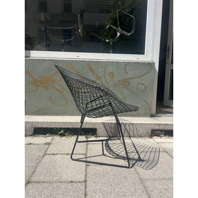 This mid-century classic was designed by Harry Bertoia and is arguably his most famous design. The elaborate, black steel...