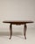 Rendered in the refined spirit of the Louis XV period, this exquisite expanding side table from mid-twentieth-century...