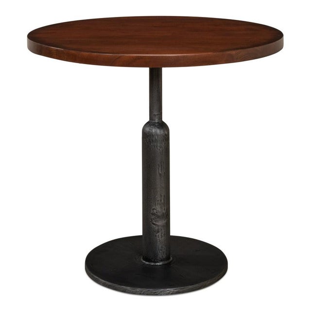 Solid walnut above a weighty iron column follows the practical construction of cafe furniture from old factory districts....