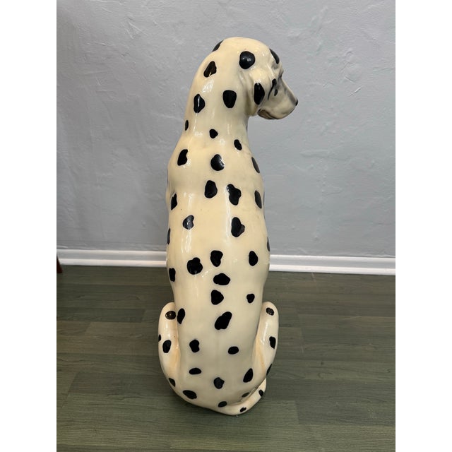 Large Hand-Painted Dalmatian Dog Sculpture This charming and lifelike Dalmatian dog sculpture makes a striking decorative...
