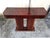 An elegant French Art Deco console table from the 1930s, featuring a beautifully crafted, architectural design. The piece...