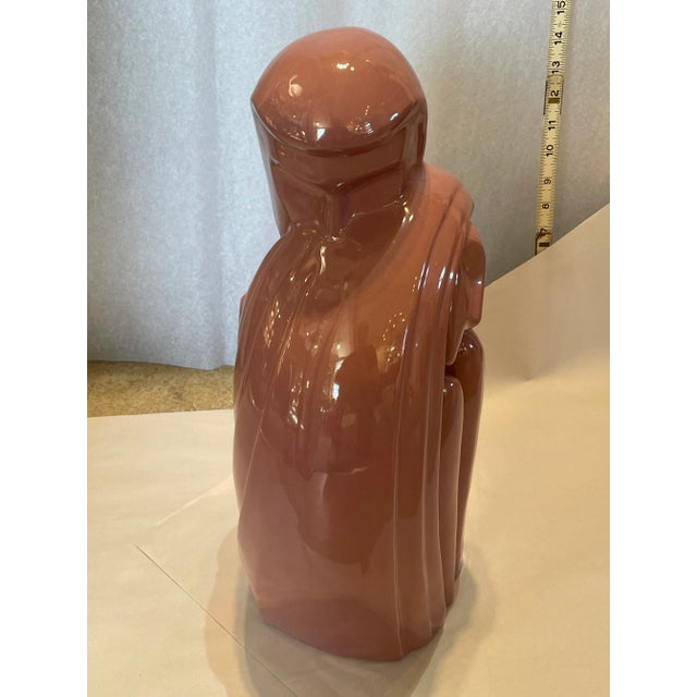 Romantic sculpture of a couple hugging. Made by Haeger ceramics circa 1989. Mauve pink color.