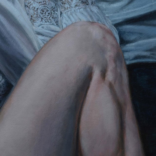 This artwork depicts a figure curled up in a fetal position, partially draped in a flowing white fabric that contrasts...
