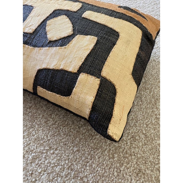 Kuba Cloth Kidney Throw Pillows. Add a touch of cultural elegance and sustainable style to your home with the Kuba Cloth...