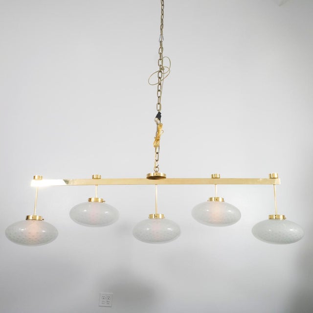 Modern linear bras chandelier with ovoid spotted Murano glass shades