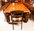 There is no mistaking the style and sophisticated design of this dining set comprising an exquisite rare English antique...