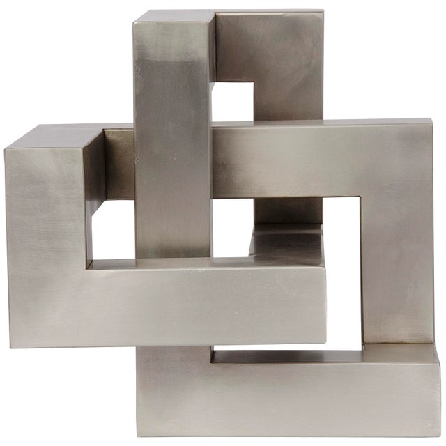 This striking metal sculpture is an unexpectedly chic way to add interest to any decor. The intriguing cubism inspired...