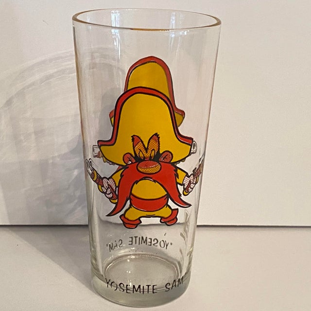 Yosemite Sam with his iconic large yellow cowboy hat, thick red mustache, and dual pistols. Vintage 1973 Pepsi Collector...