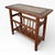 A charming mid-century teak magazine rack featuring a decorative tiled top, combining practicality with classic period...