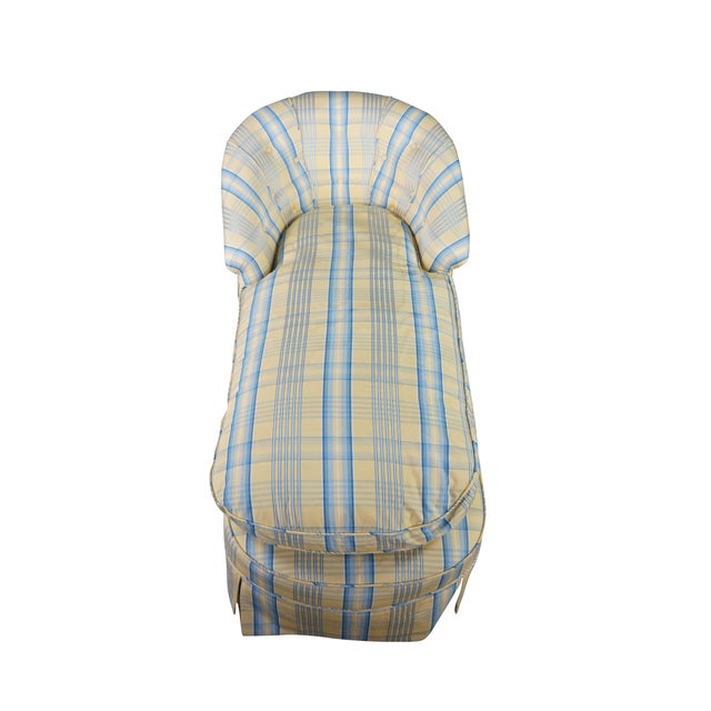 This early 20th-century chaise longue features a classic, sweeping silhouette fully enveloped in a yellow and blue plaid...
