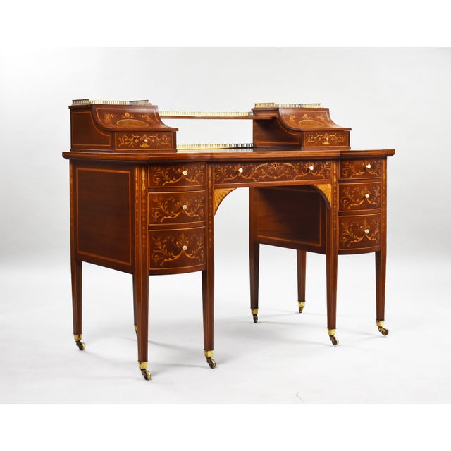 For sale is a top quality Victorian Sheraton revival marquetry inlaid carlton house desk attributed to Edwards & Roberts....
