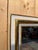 A louis xvi style rectangular vertical mirror with a white lacquered and gilded wooden frame. the frame consists of an...