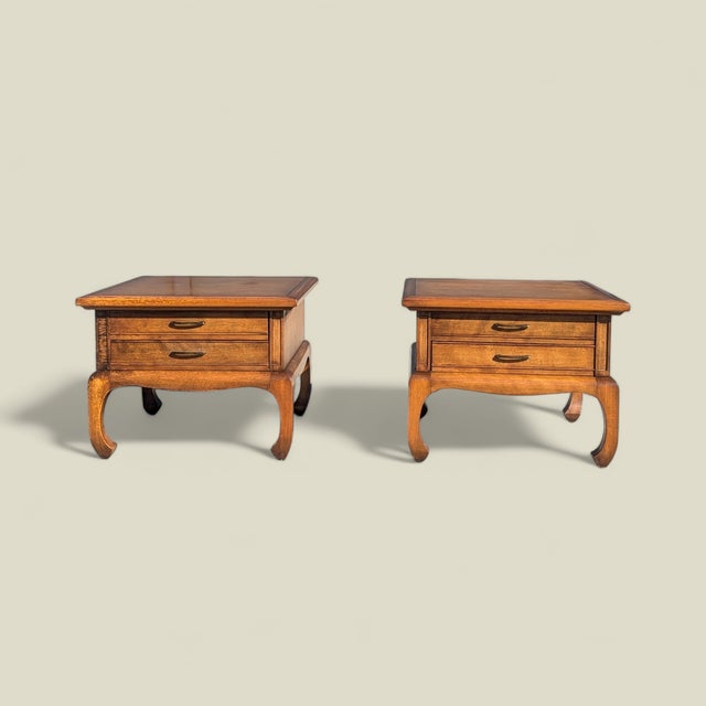 A substantial pair of square solid-wood nightstands with chinoiserie character and generous 27-inch tops. Their matched...