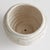 With a reactive glaze and hand finished ribbing detail, this charming pot is a great find. Plant your favorite lush greens...