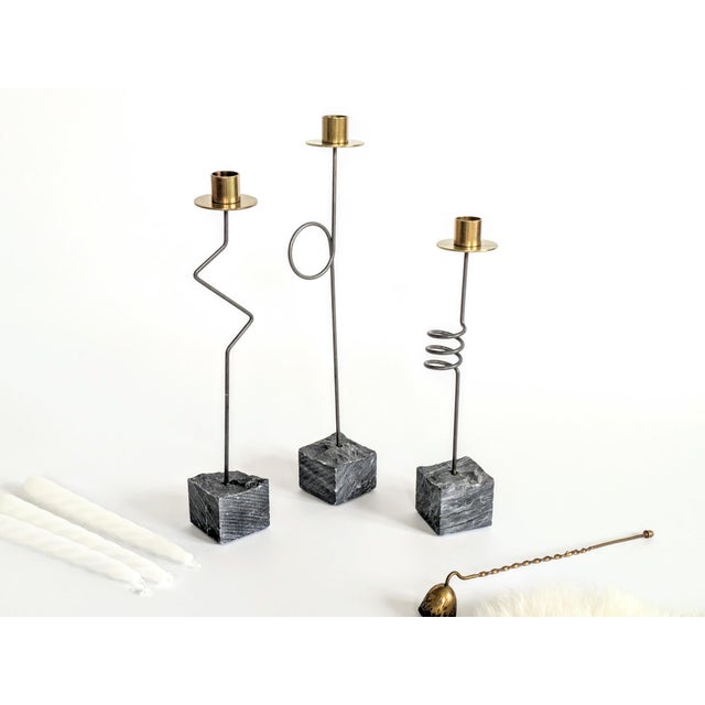 This set is composed of 3 candleholders with assorted heights: 38cm, 35 cm, and 30.5 cm. This piece is attributed to the...