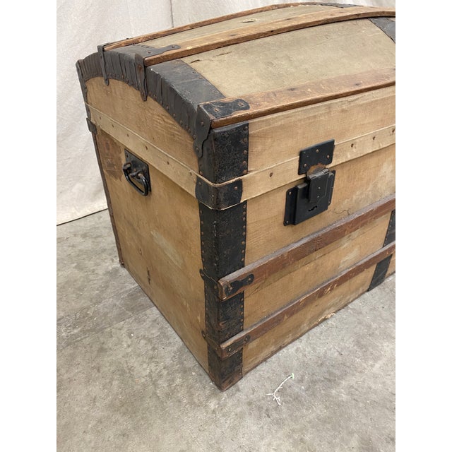Handsome Italian antique travel trunk with wood strapping, and meta accents. This stylish trunk has a lovely tan canvas...