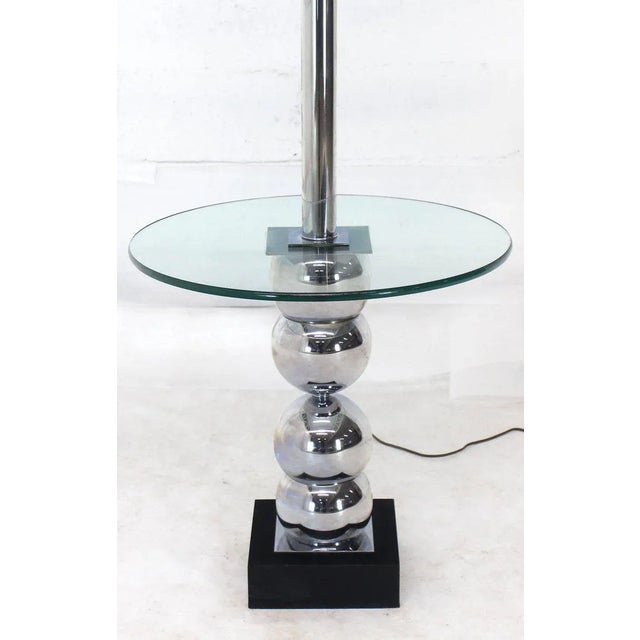 Mid-Century Modern stack chrome side table floor lamp. Made in the mid 20th century.