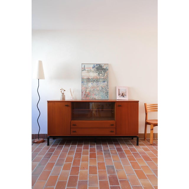 A teak sideboard by Marcel Gascoin, edition Alveole, made in France in the 1960s and stamped Alveole inside the cabinet....