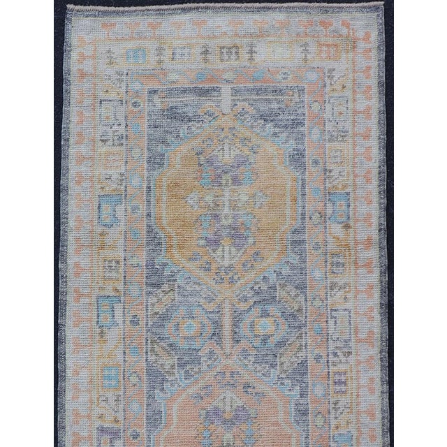 Measures: 2'7 x 8'1 Turkish Oushak Runner in Powder Blue, Peach, and Gold 2'7 x 8'1 Keivan Woven Arts. rug /EN-5008/ Early...