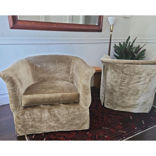 Pair of authentic Marge Carson swivel club chairs upholstered in luxurious sage green velvet with a soft, luminous sheen....