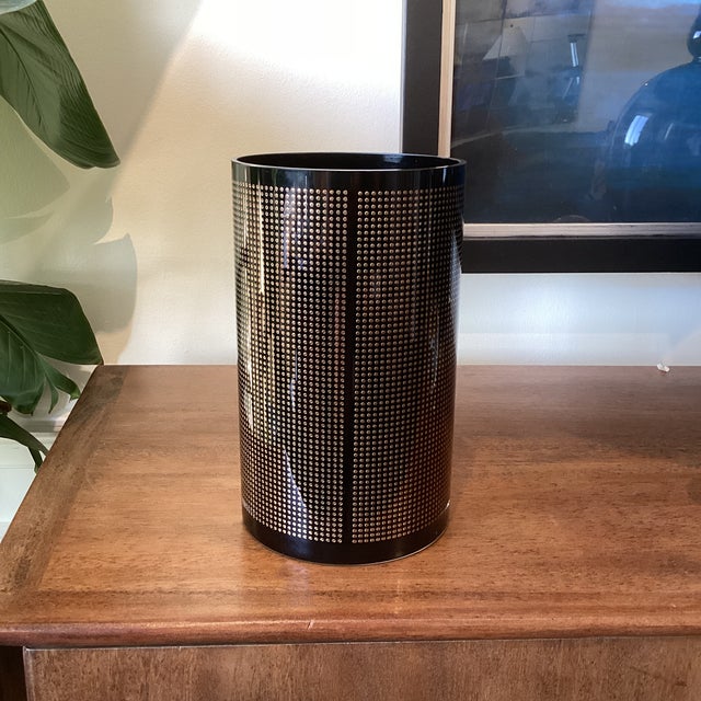 A striking cylindrical art glass vase designed by Koz Susani for Egizia, featuring a dramatic black ground wrapped in a...