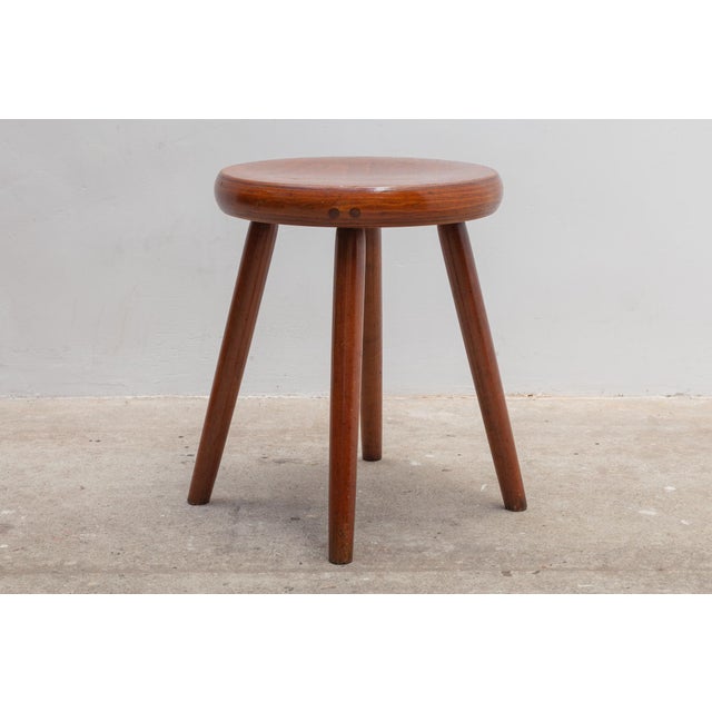 Nordic stools in rich brown wood with four pegged legs. Very nice patina and good condition. Seat height 45 cm.
