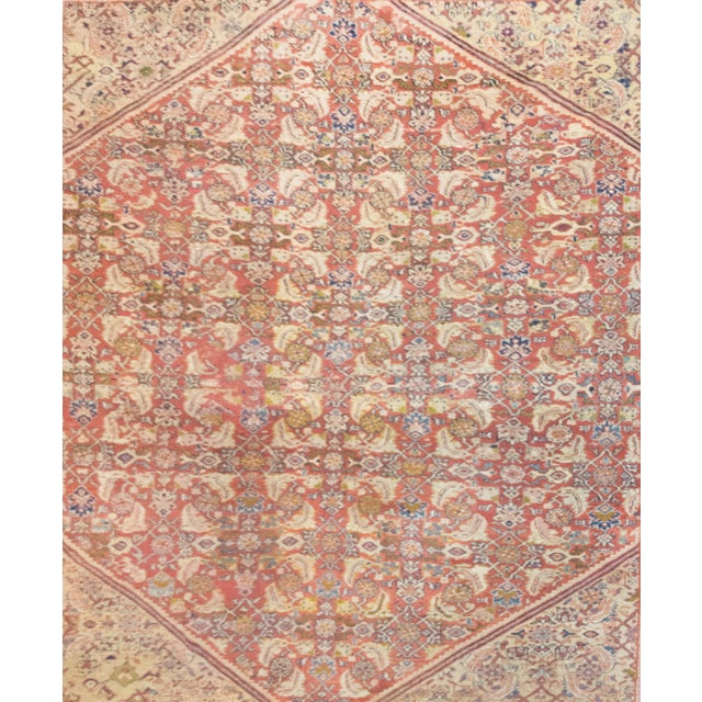 A magnificent late 19th-century Persian Mahal Sultanabad rug, woven with an intricate allover mirrored trellis design of...