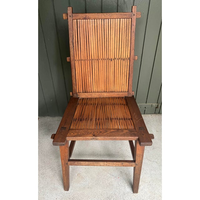 A compelling matching set of four antique Chinese "Lamp-Hanger" side chairs (Dengguanyi), exemplifying the classic...
