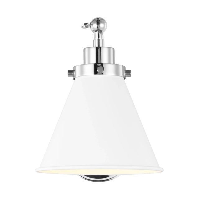 Inspired by various classic utility silhouettes - from factory lighting to barn sconces - capped by contrasting metal...