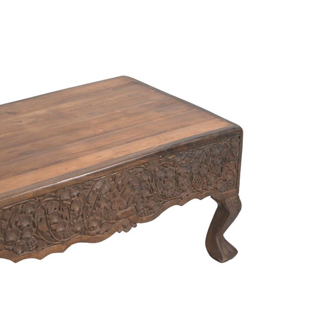 This Vintage Indian Teakwood Carved Bench is an elegant handcrafted seating piece constructed from solid teakwood,...