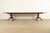 A gorgeous Georgian, Regency, or Queen Anne style solid carved cherry wood double pedestal extension dining table By...