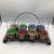 Great 8 glass caddy with 8 plastic wrapped highball glasses. Caddy is rolled steel with a bronze finish. There’s 4 sets of...