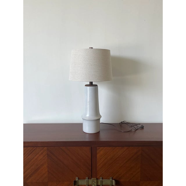 A large and elegant table lamp designed by famed ceramicist duo Jane and Gordon Martz for Marshall Studios. Lamp consists...
