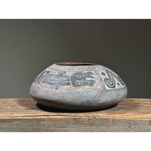 Vintage Mexican Sgraffito Folk Art Zoomorphic Clay Vase. Matte sgraffito exterior with animals etched into the body of the...