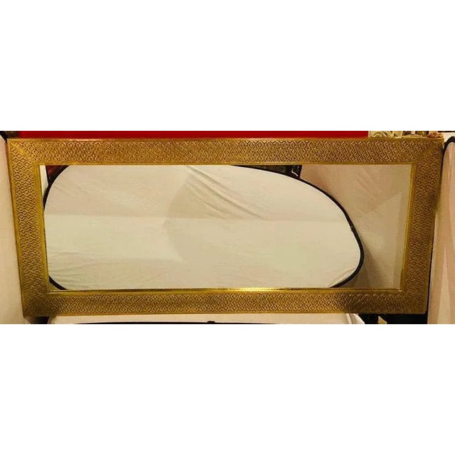 A large palatial handmade floor or console mirror. The mirror is made of fine brass in a diamond shaped craft design. The...