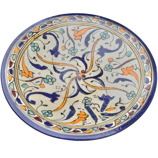 One-of-a-kind antique handcrafted and glazed Moroccan ceramic plate from Fez. Featuring an elaborate hand-painted colorful...