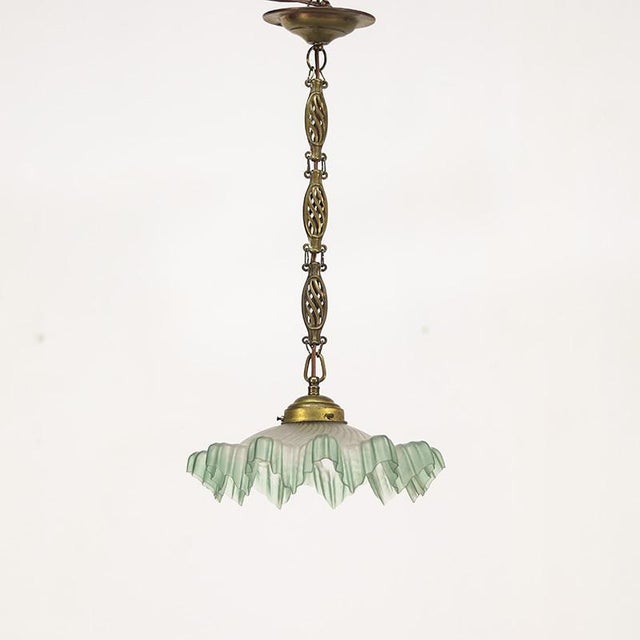 Unique Piecrust pendant lamp from France, dating from the 1930s. The lampshade has a rich and decorative design and is...