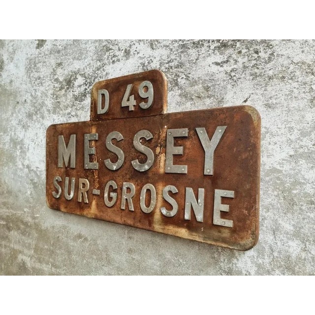Vintage place name sign from the French Messey-sur-Grosne. This metal sign contains aluminum riveted letters. This place...