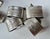 Complete set of sixteen vintage silver-tone metal napkin rings divided between embossed “Monsieur” and “Madame” designs....