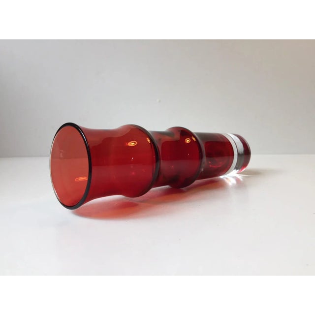 This is a modernist glass vase called 'Bamboo' designed by Swedish Bo Bergström and manufactured by Aseda Glasbruk during...