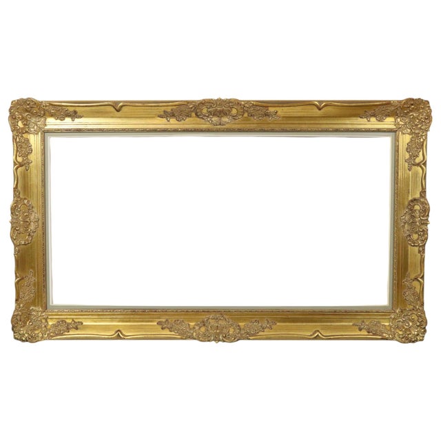 Large gilded vintage pine frame with a beautiful aged patina, XL size, entirely in classic Baroque style, decorated with...