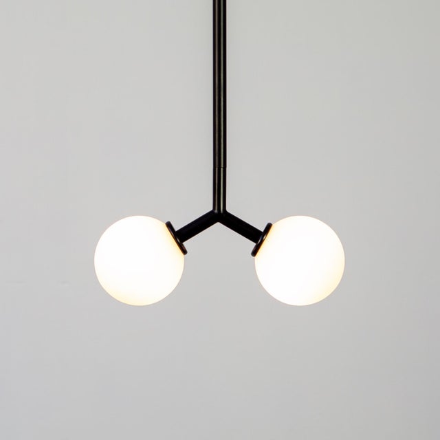 Cute and clean, the Y Mini Pendant Light isn’t trying to do too much; it’s doing just the right amount. Suspended by a...
